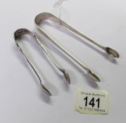 2 sets of silver sugar tongs.