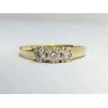An 18ct yellow gold 2.7 gram 3 stone diamond ring, size L.