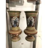 A pair of Mettlach vases with identical panels around vase of 2 girls.