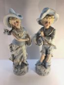 A pair of 19th century porcelain figures, 33 cm tall.