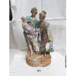 A fine 19th century continental porcelain figure group of a couple with baby. 37 cm tall.