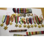A collection of miniature medals and stars, a boxing medal, rifle medal etc.