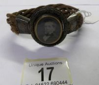 A Victorian double sided mourning arm band.