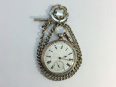 A silver pocket watch on silver chain with silver fob, in working order.