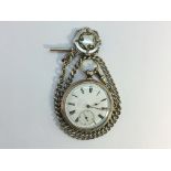 A silver pocket watch on silver chain with silver fob, in working order.