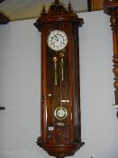 A mahogany double regulator wall clock.