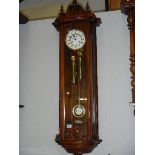 A mahogany double regulator wall clock.