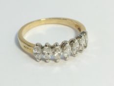 An 18ct yellow gold 7 stone diamond ring, size K.