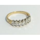 An 18ct yellow gold 7 stone diamond ring, size K.