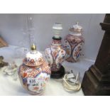 2 oriental style lidded jars and a table lamp base.