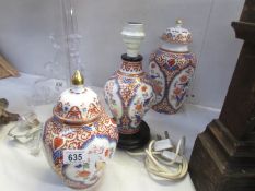 2 oriental style lidded jars and a table lamp base.