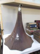 A large Victorian gramophone horn with elbow.