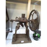 An old grinder/mincer on stand.