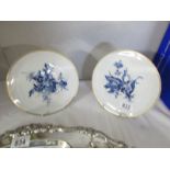 2 hand painted Meissen plates with blue floral design and gold features.