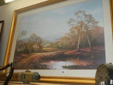 A large framed and glazed rural scene print.