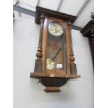 A mahogany wall clock.