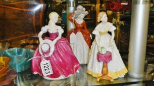 2 Coalport Ladies of Fashion figurines and a Royal Doulton Happy Birthday figurine.