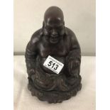 A heavy resin Laughing Buddha.