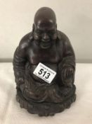 A heavy resin Laughing Buddha.