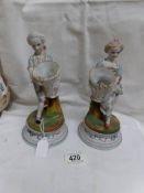 A pair of 19th century continental bisque porcelain figurines.