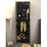 A Japanese lacquered wall panel with mother of pearl Geisha scenes.