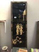 A Japanese lacquered wall panel with mother of pearl Geisha scenes.