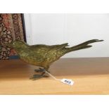 A brass bird.