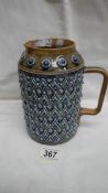 A Doulton Lambeth 1877 jug by Harriet E Hibut.