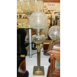 A brass Corinthian column oil lamp with font & etched shade