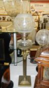 A brass Corinthian column oil lamp with font & etched shade