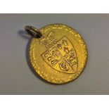 A George III gold guinea as a pendant (9 grams).