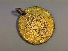 A George III gold guinea as a pendant (9 grams).