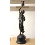 A French bronze figure of a lady, signed.