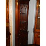 A mahogany astragal glazed corner cabinet.