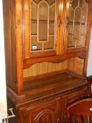 A stained pine glazed top dresser.