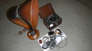 A rare working crystal set with horn and base, 2 pairs of headphones,