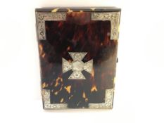 A 19th century silver and tortoise shell card case with silk lining.