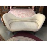 A cream double ended chaise longue.