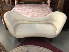 A cream double ended chaise longue.