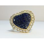 An 18ct gold sapphire and diamond heart shaped ring, size U.