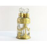 A set of 3 antique French Baccarat scent bottles in ormolu stand.