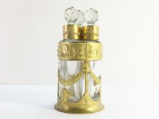 A set of 3 antique French Baccarat scent bottles in ormolu stand.