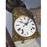 A 1900's French Meunier porcelain clock movement with bracket for wall mounting.
