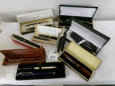 A collection of cased pen sets.