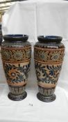 A pair of large Doulton Lambeth vases, well patterned using different techniques in green, blue,