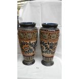 A pair of large Doulton Lambeth vases, well patterned using different techniques in green, blue,