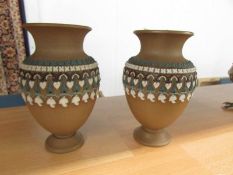 A pair of Doulton Lambeth stoneware silicon vases.
