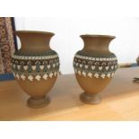 A pair of Doulton Lambeth stoneware silicon vases.