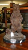 A bronze bear with cub