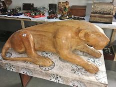A one piece carved wood jaguar signed Marcio Anezio (Brazilian artist).